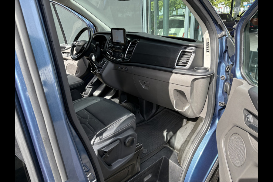 Ford Transit Custom 320 2.0 TDCI L2H1 Platinum Edition DC Automaat Achteruitrijcamera - Parkeersensoren - Navigatie - Airco - Dodehoek detector - Cruise control - Licht metalen velgen 16 inch - Lederen bekleding - Radio - Bluetooth - Dubbele cabine - Tussens - Mistlampen voor - Sidebars - Trekhaak - Voorstoelen verwarmd - Led verlichting - Extra getint glas achter - Start/stop systeem - Stuur multifunctioneel - Stuur leder - Regensensor