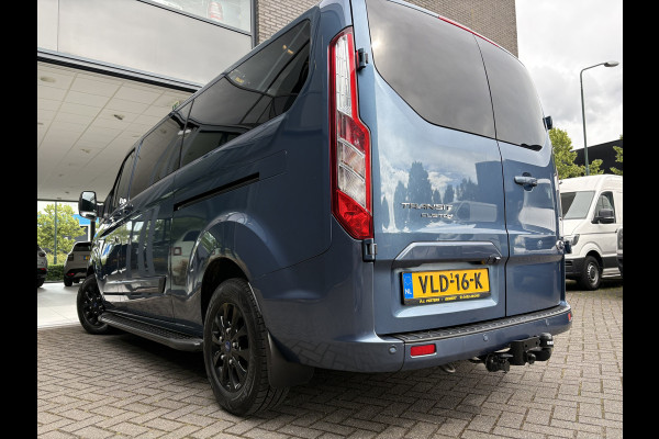 Ford Transit Custom 320 2.0 TDCI L2H1 Platinum Edition DC Automaat Achteruitrijcamera - Parkeersensoren - Navigatie - Airco - Dodehoek detector - Cruise control - Licht metalen velgen 16 inch - Lederen bekleding - Radio - Bluetooth - Dubbele cabine - Tussens - Mistlampen voor - Sidebars - Trekhaak - Voorstoelen verwarmd - Led verlichting - Extra getint glas achter - Start/stop systeem - Stuur multifunctioneel - Stuur leder - Regensensor