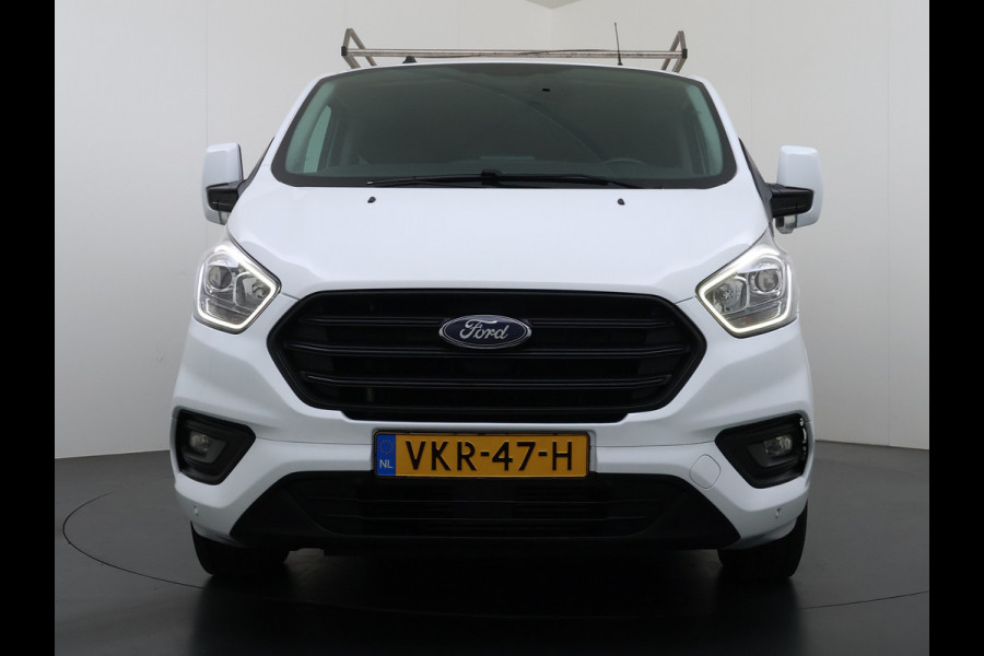 Ford Transit Custom 300 2.0TDCI L2H1 Dubbele Cabine 6-Persoons Trekhaak Navi Camera Cruise Control Imperiaal Airco Stoelverwarming Pdc DC DAB Bluetooth Betonplex Vloer Wandbetimmering 2.750KG Trekgewicht Origineel Nederlandse Auto