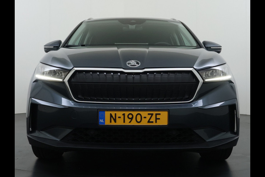 Škoda ENYAQ iV 80 Trekhaak SOH 95% Warmtepomp Adap.Cruise 3-Zone Ecc 360°Camera Stuur+Stoelverwarming Navi Ecc Pdc Draadloze telefoonlader Keyless Privacy Glas Lmv Led Apple Carplay Android Auto DAB P-Assist Dodehoek detectie File Asist 1.000KG Trekgewicht Origineel Nederlandse Auto