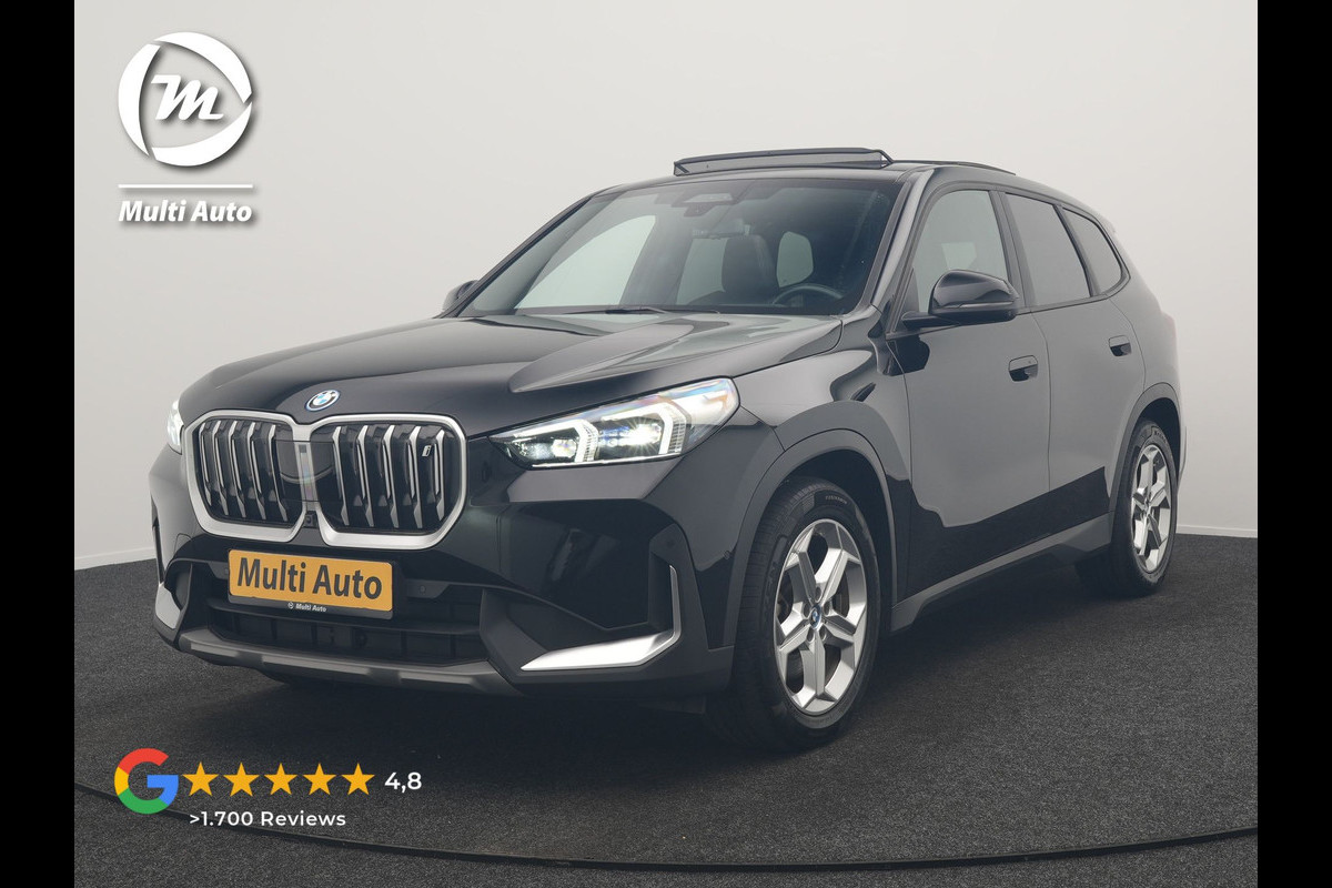 BMW iX1 xDrive30 67 kWh 313pk Dealer O.H. | Trekhaak Af Fabriek | Panodak | Adaptive Cruise | Head Up | 360 Camera | Harman / Kardon | Adaptief Onderstel | Lederen Sportstoelen Massage & Verwarmd | Stuur Verwarmd | Hifi Audio | Keyless | Blis |