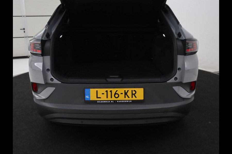 Volkswagen ID.4 Tech 77 kWh | SOH 92,2% | Panorama | 360 Camera | Head up | Virtual cockpit | Sfeerverlichting | Stoel/Stuurverwarming | Adaptive cruise | Carplay | Traffic assist | Climate control | Half leder/velours
