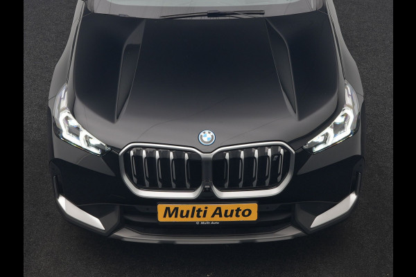 BMW iX1 xDrive30 67 kWh 313pk Dealer O.H. | Trekhaak Af Fabriek | Panodak | Adaptive Cruise | Head Up | 360 Camera | Harman / Kardon | Adaptief Onderstel | Lederen Sportstoelen Massage & Verwarmd | Stuur Verwarmd | Hifi Audio | Keyless | Blis |