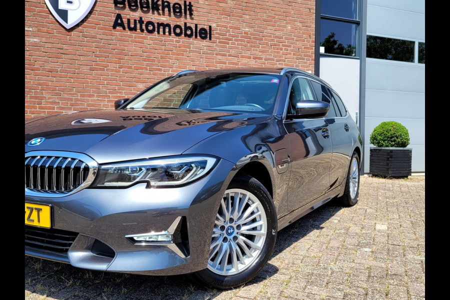 BMW 3 Serie Touring 320e Luxury - Pano, Trekhaak, Laser (NL NAP BTW)