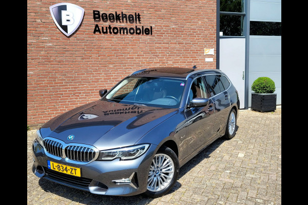BMW 3 Serie Touring 320e Luxury - Pano, Trekhaak, Laser (NL NAP BTW)