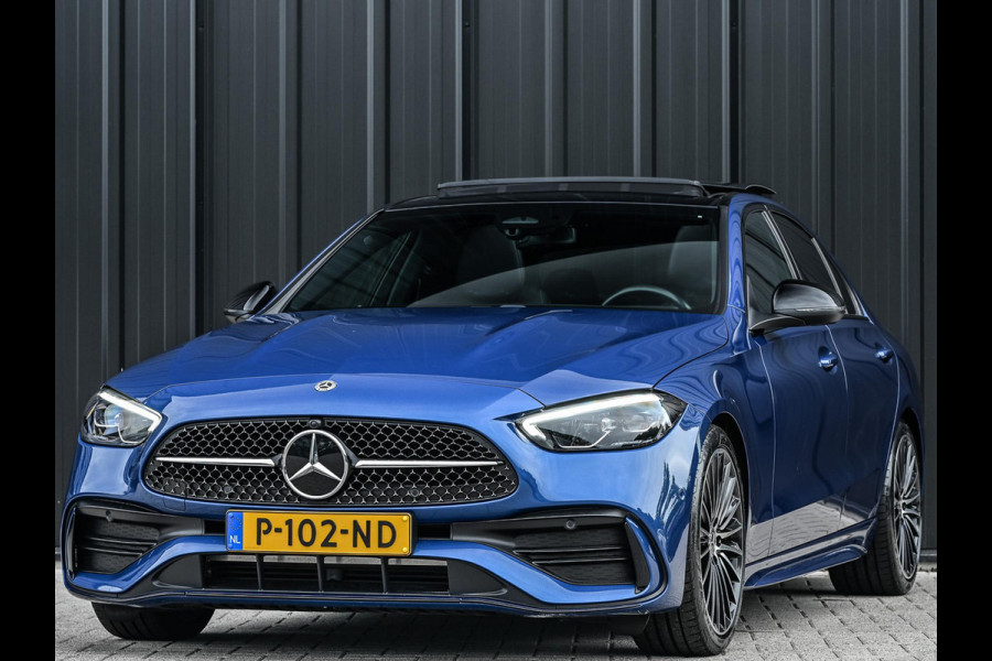 Mercedes-Benz C-Klasse 180 AMG Line | NL-Auto | Panoramadak | Night-Pakket | Ambiance Interieur | Camera | Elektr. Verst. Voorstoelen + Verwarming |