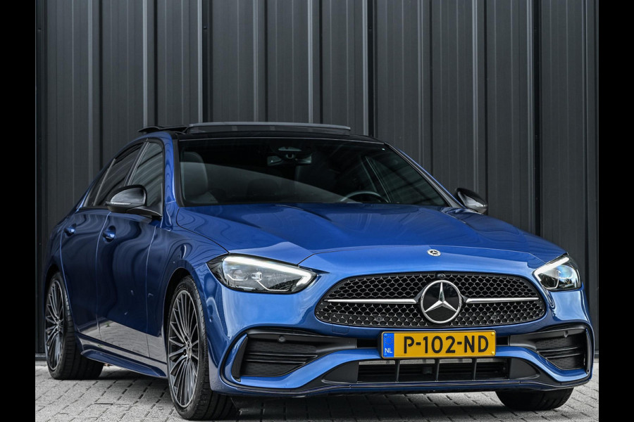 Mercedes-Benz C-Klasse 180 AMG Line | NL-Auto | Panoramadak | Night-Pakket | Ambiance Interieur | Camera | Elektr. Verst. Voorstoelen + Verwarming |