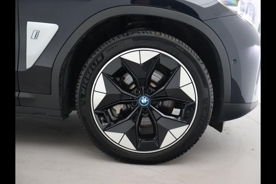 BMW iX3 HIGH EXECUTIVE 80 kWh + TREKHAAK | PANORAMA | 360 CAMERA | ADAPTIVE CRUISE | SFEERVERLICHTING