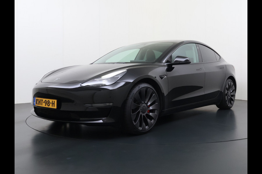 Tesla Model 3 Performance AWD 513PK Facelift Warmtepomp Lmv 20" Panoramadak Adap.Cruise Elek.Verwarmde Stoelen+Memory Inductieladen Navi Camer SOH 85.6% Led Pdc Privacy Glas Elek.Achterklep Keyless 4WD Fabrieksgarantie op Accu en Motor tot 18-02-2029/192.000KM