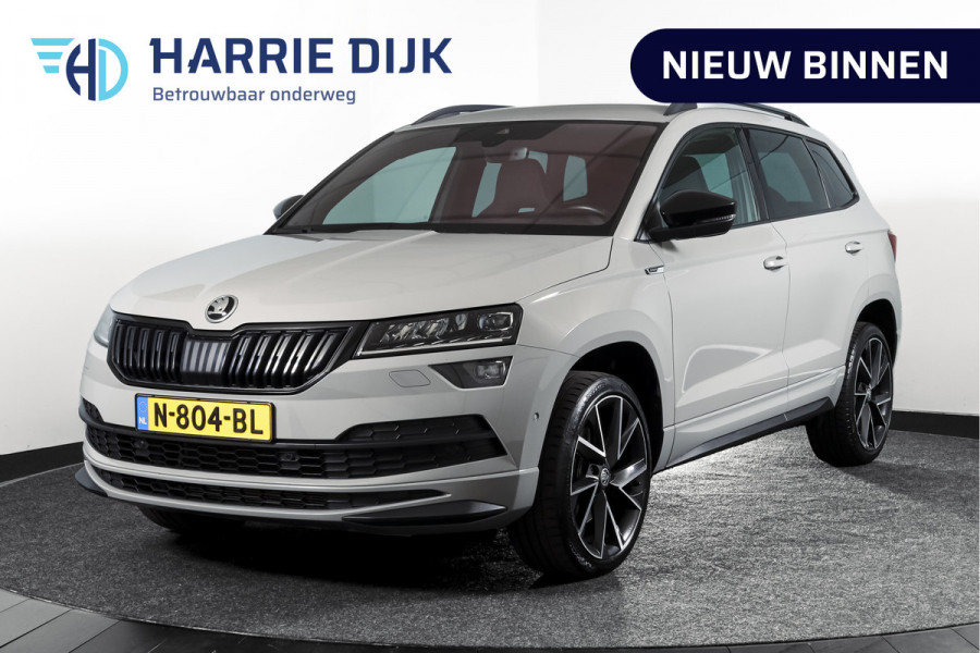 Škoda Karoq 1.5 TSI ACT Sportline Business 150 PK | Dig. Cockpit | Adapt. Cruise | Winterpakket | PDC | Camera | NAV + App. Connect | ECC | Elek. Trekhaak | LM 19" |