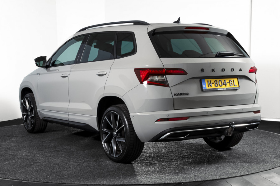 Škoda Karoq 1.5 TSI ACT Sportline Business 150 PK | Dig. Cockpit | Adapt. Cruise | Winterpakket | PDC | Camera | NAV + App. Connect | ECC | Elek. Trekhaak | LM 19" |