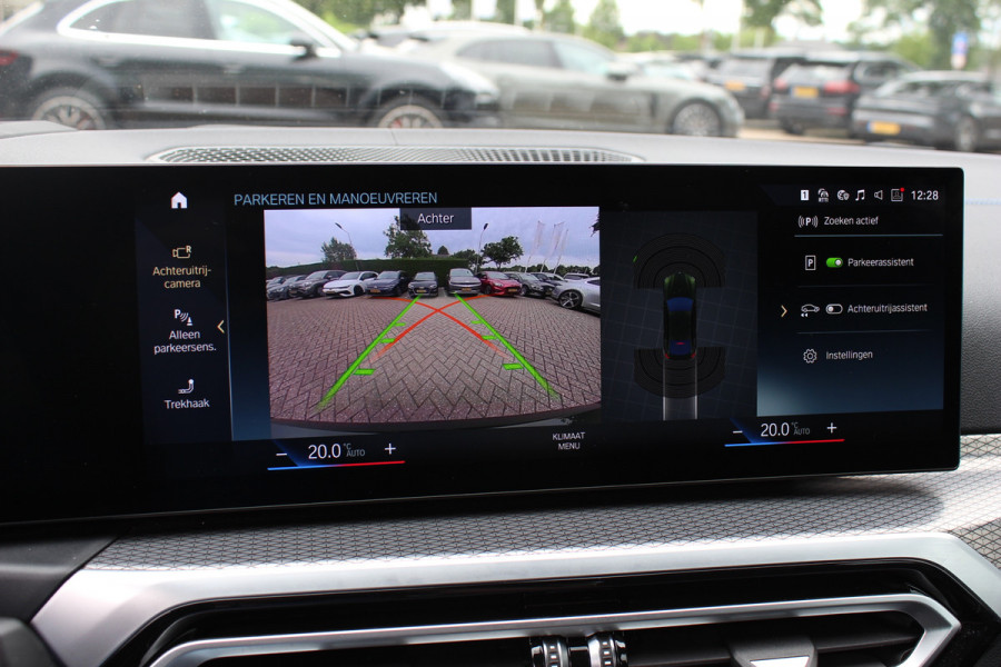 BMW i4 eDrive40 High Executive 84 kWh / SoH 95% / Trekhaak / Schuifdak / Camera / Head-up / Leder / 19'' / CarPlay / Stoelverwarming / Sfeerverlichting / Dodehoek / ACC