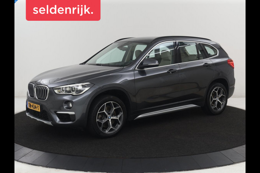 BMW X1 sDrive20i Orange Edition II | Leder | Trekhaak | Head-up | Park assist | Sfeerverlichting | Stoelverwarming | Climate control | Full LED | Navigatie |