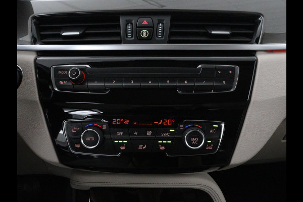 BMW X1 sDrive20i Orange Edition II | Leder | Trekhaak | Head-up | Park assist | Sfeerverlichting | Stoelverwarming | Climate control | Full LED | Navigatie |