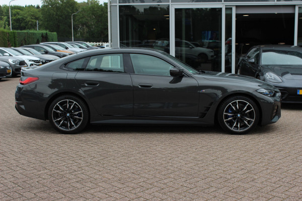 BMW i4 M50 High Executive 84 kWh / SoH 96,6% / 360Camera / Head-up / Leder / Harman Kardon / Carbon intr.+extr. / 19'' / CarPlay / Stoelverwarming / Dodehoek / DAB / Cruise Control Adaptief