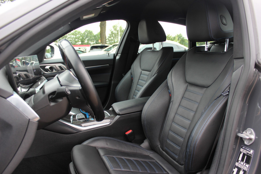BMW i4 M50 High Executive 84 kWh / SoH 96,6% / 360Camera / Head-up / Leder / Harman Kardon / Carbon intr.+extr. / 19'' / CarPlay / Stoelverwarming / Dodehoek / DAB / Cruise Control Adaptief