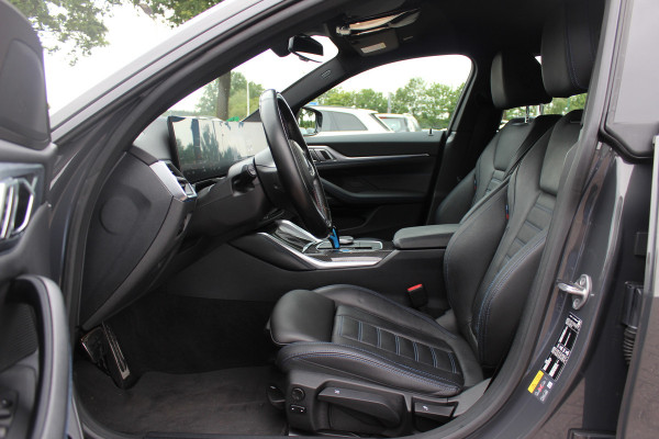 BMW i4 M50 High Executive 84 kWh / SoH 96,6% / 360Camera / Head-up / Leder / Harman Kardon / Carbon intr.+extr. / 19'' / CarPlay / Stoelverwarming / Dodehoek / DAB / Cruise Control Adaptief