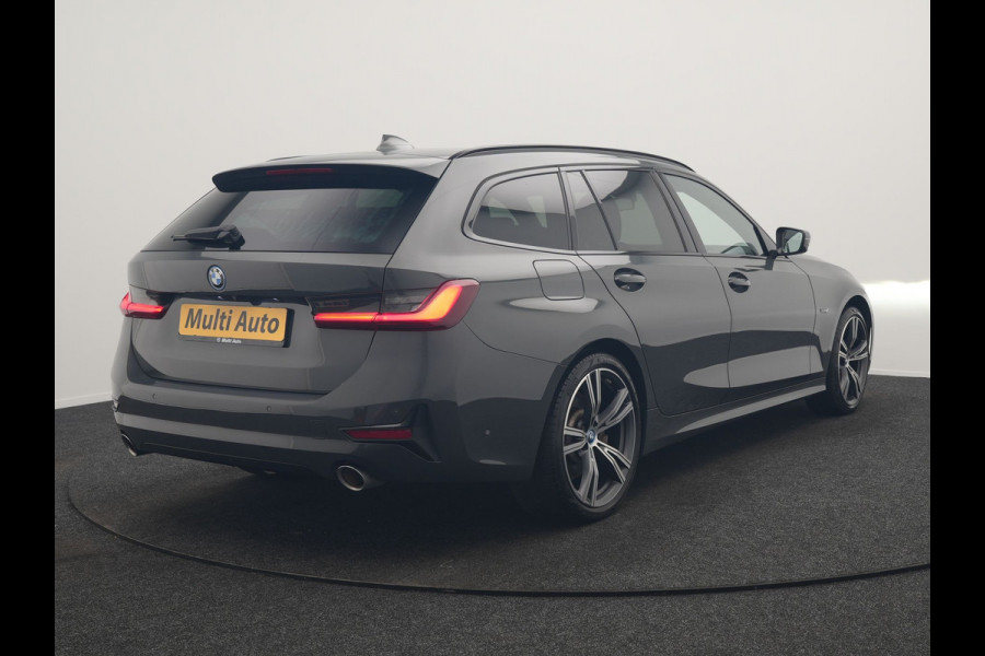 BMW 3 Serie Touring 330e Sportline PHEV 293pk Dealer O.H. | Dravitgrau | Trekhaak Af Fabriek | Adaptive Cruise | Laser LED | Head Up | Adaptief Onderstel | Camera | Sportstoelen Verwarmd | Sfeerverlichting | Keyless | Blis | Apple Carplay | 19"L.M | Plug In Hybrid |