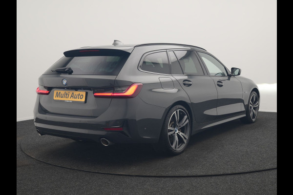 BMW 3 Serie Touring 330e Sportline PHEV 293pk Dealer O.H. | Dravitgrau | Trekhaak Af Fabriek | Adaptive Cruise | Laser LED | Head Up | Adaptief Onderstel | Camera | Sportstoelen Verwarmd | Sfeerverlichting | Keyless | Blis | Apple Carplay | 19"L.M | Plug In Hybrid |