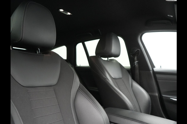 BMW 3 Serie Touring 330e Sportline PHEV 293pk Dealer O.H. | Dravitgrau | Trekhaak Af Fabriek | Adaptive Cruise | Laser LED | Head Up | Adaptief Onderstel | Camera | Sportstoelen Verwarmd | Sfeerverlichting | Keyless | Blis | Apple Carplay | 19"L.M | Plug In Hybrid |