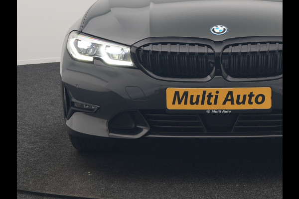 BMW 3 Serie Touring 330e Sportline PHEV 293pk Dealer O.H. | Dravitgrau | Trekhaak Af Fabriek | Adaptive Cruise | Laser LED | Head Up | Adaptief Onderstel | Camera | Sportstoelen Verwarmd | Sfeerverlichting | Keyless | Blis | Apple Carplay | 19"L.M | Plug In Hybrid |