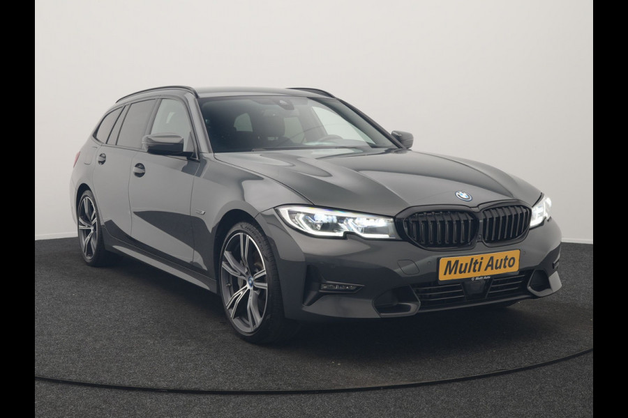 BMW 3 Serie Touring 330e Sportline PHEV 293pk Dealer O.H. | Dravitgrau | Trekhaak Af Fabriek | Adaptive Cruise | Laser LED | Head Up | Adaptief Onderstel | Camera | Sportstoelen Verwarmd | Sfeerverlichting | Keyless | Blis | Apple Carplay | 19"L.M | Plug In Hybrid |