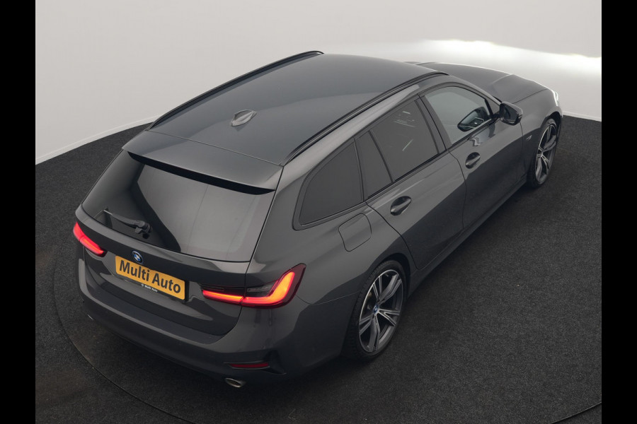 BMW 3 Serie Touring 330e Sportline PHEV 293pk Dealer O.H. | Dravitgrau | Trekhaak Af Fabriek | Adaptive Cruise | Laser LED | Head Up | Adaptief Onderstel | Camera | Sportstoelen Verwarmd | Sfeerverlichting | Keyless | Blis | Apple Carplay | 19"L.M | Plug In Hybrid |