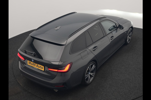 BMW 3 Serie Touring 330e Sportline PHEV 293pk Dealer O.H. | Dravitgrau | Trekhaak Af Fabriek | Adaptive Cruise | Laser LED | Head Up | Adaptief Onderstel | Camera | Sportstoelen Verwarmd | Sfeerverlichting | Keyless | Blis | Apple Carplay | 19"L.M | Plug In Hybrid |