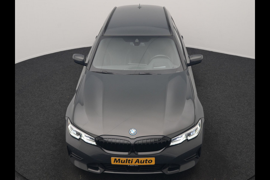 BMW 3 Serie Touring 330e Sportline PHEV 293pk Dealer O.H. | Dravitgrau | Trekhaak Af Fabriek | Adaptive Cruise | Laser LED | Head Up | Adaptief Onderstel | Camera | Sportstoelen Verwarmd | Sfeerverlichting | Keyless | Blis | Apple Carplay | 19"L.M | Plug In Hybrid |