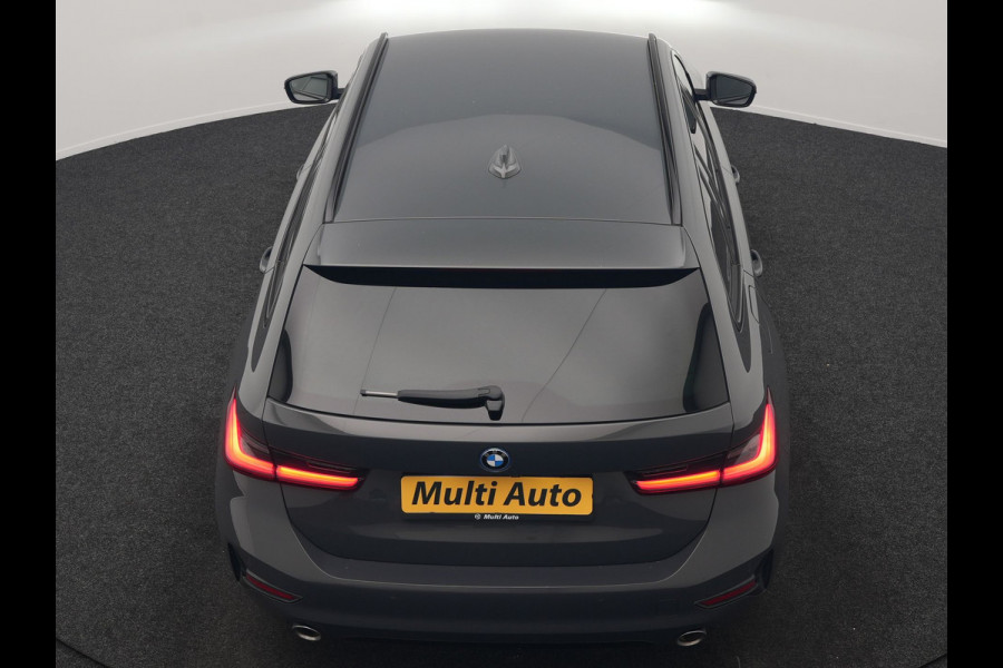 BMW 3 Serie Touring 330e Sportline PHEV 293pk Dealer O.H. | Dravitgrau | Trekhaak Af Fabriek | Adaptive Cruise | Laser LED | Head Up | Adaptief Onderstel | Camera | Sportstoelen Verwarmd | Sfeerverlichting | Keyless | Blis | Apple Carplay | 19"L.M | Plug In Hybrid |