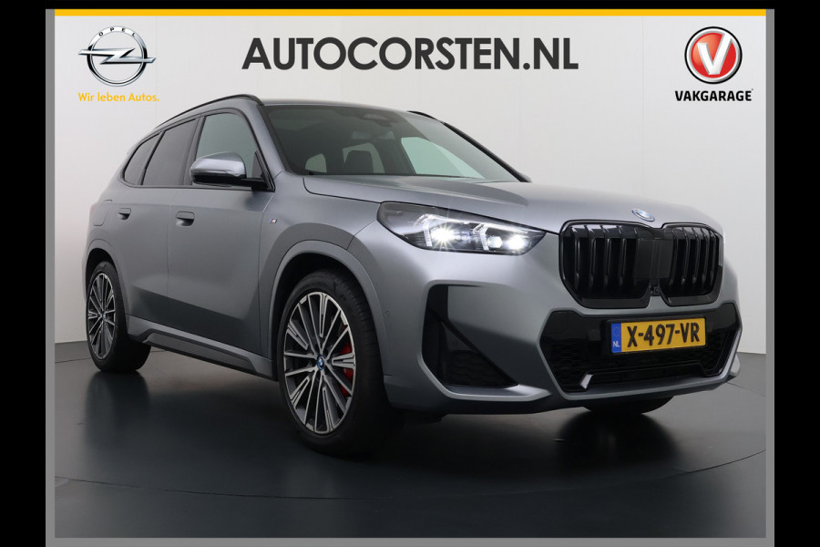 BMW X1 xDrive30e 327pk M-sport Leer Pano-Dak/Hef-Dak M-Sportstoelen+Elektr.+Geheugen+Verwarmd Trekhaak Harman-Kardon Adaptive-LED Live- Adaptive-Cruise AWD StuurVerwarmd Zwarte-Hemel Travelpack Park-Assist Pdc Draadloze lader Innovations-pakket Comfort-Pack €75.000,- Nieuw  Orig.NL auto! 1.800kg trekvermogen