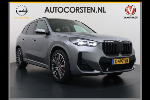 BMW X1 xDrive30e 327pk M-sport Leer Pano-Dak/Hef-Dak M-Sportstoelen+Elektr.+Geheugen+Verwarmd Trekhaak Harman-Kardon Adaptive-LED Live- Adaptive-Cruise AWD StuurVerwarmd Zwarte-Hemel Travelpack Park-Assist Pdc Draadloze lader Innovations-pakket Comfort-Pack €75.000,- Nieuw  Orig.NL auto! 1.800kg trekvermogen