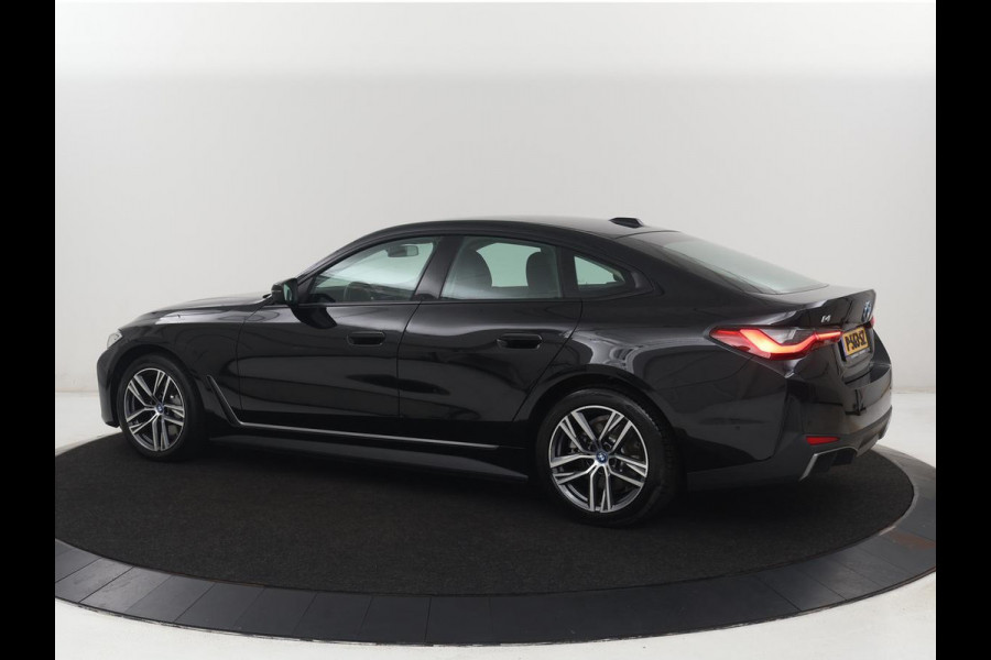 BMW i4 eDrive40 84 kWh | SOH 93,8% | Camera | Adaptive cruise | Climate control | Navigatie | DAB+ | Bluetooth | Stoelverwarming | Carplay
