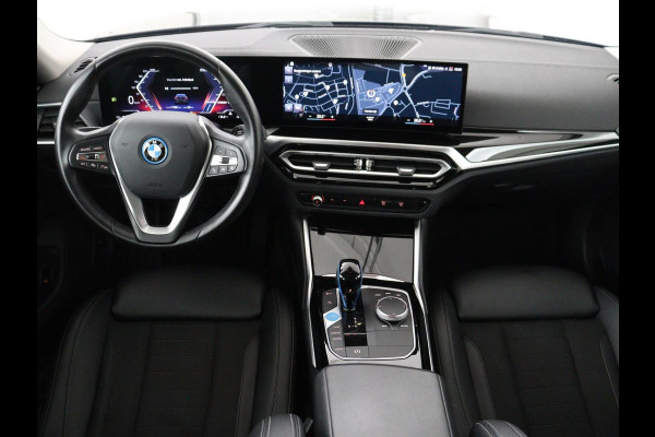 BMW i4 eDrive40 84 kWh | SOH 93,8% | Camera | Adaptive cruise | Climate control | Navigatie | DAB+ | Bluetooth | Stoelverwarming | Carplay