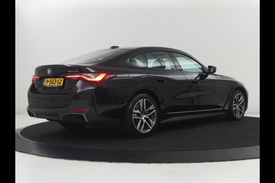 BMW i4 eDrive40 84 kWh | SOH 93,8% | Camera | Adaptive cruise | Climate control | Navigatie | DAB+ | Bluetooth | Stoelverwarming | Carplay
