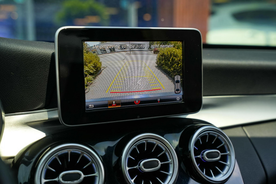 Mercedes-Benz C-Klasse 180 Business Solution AMG Panoramadak 3D Burmester Ambient Camera Stoelverwarming Leer Cruise Control