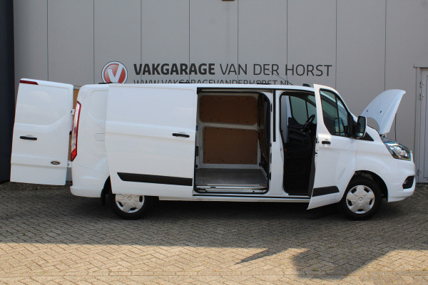 Ford Transit Custom 300 2.0-108pk TDCI L2H1 Trend. Erg nette Ford Transit Custom, die u nog jaren van dienst kan zijn ! Airco, voorraamverw., trekhaak, cruise control, camera, parkeersensoren v+a, 3-zits, laadruimte betimmerd etc.