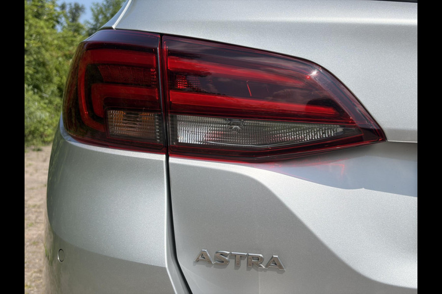 Opel Astra Sports Tourer 1.2 Ultimate 146pk,Camera,Keyless,Carplay,6 Bak,Afn Trekhaak,Stoelverw,Lm velgen,Alcantara-Leder,Dealer Onderhouden,Clima,Cruise,Dodehoek,Rijstrooksensor,N.A.P,PDc V+A,Apk tot 07-2028
