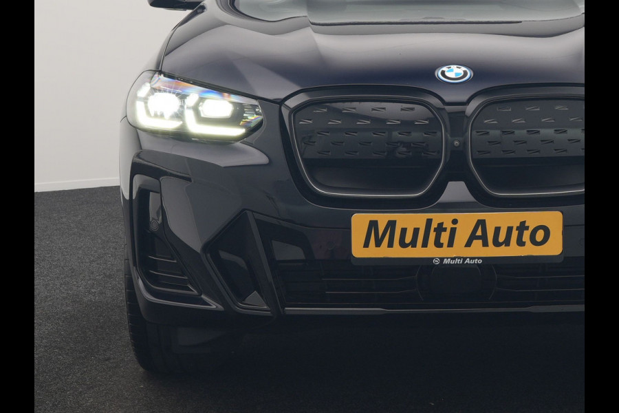 BMW iX3 M Sport High Executive 80 kWh 286pk Dealer O.H. SOH 95% | Trekhaak Af Fabriek | Panodak | Head Up | 360 Camera | Harman / Kardon | Lederen Sportstoelen Memory & Verwarmd | Keyless | Blis | Sfeerverlichting | 20"L.M | Adaptive LED |