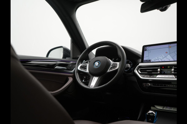 BMW iX3 M Sport High Executive 80 kWh 286pk Dealer O.H. SOH 95% | Trekhaak Af Fabriek | Panodak | Head Up | 360 Camera | Harman / Kardon | Lederen Sportstoelen Memory & Verwarmd | Keyless | Blis | Sfeerverlichting | 20"L.M | Adaptive LED |