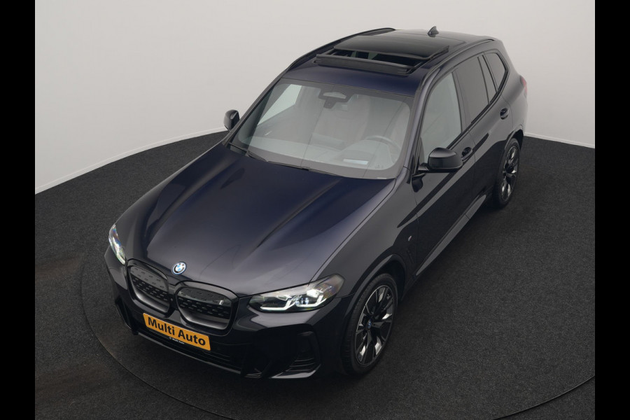 BMW iX3 M Sport High Executive 80 kWh 286pk Dealer O.H. SOH 95% | Trekhaak Af Fabriek | Panodak | Head Up | 360 Camera | Harman / Kardon | Lederen Sportstoelen Memory & Verwarmd | Keyless | Blis | Sfeerverlichting | 20"L.M | Adaptive LED |