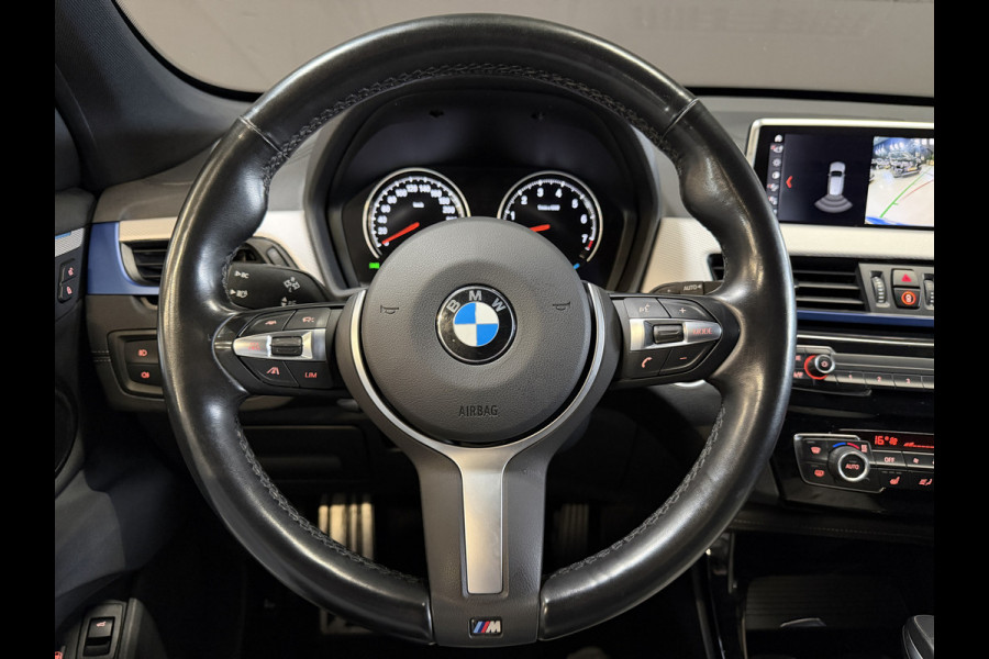 BMW X1 xDrive25e High Executive | M-pakket | Camera | Afn. trekhaak | Leder | Sfeerverlichting | Full LED