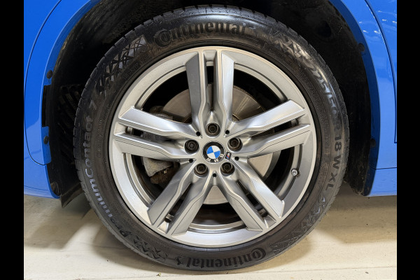 BMW X1 xDrive25e High Executive | M-pakket | Camera | Afn. trekhaak | Leder | Sfeerverlichting | Full LED