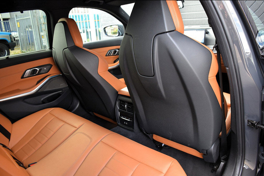 BMW 3 Serie Touring 330e*M-Pakket*Dak*Trekhaak*142Dkm*Keyless*2023*Dravit Grau*INDIVIDUAL*