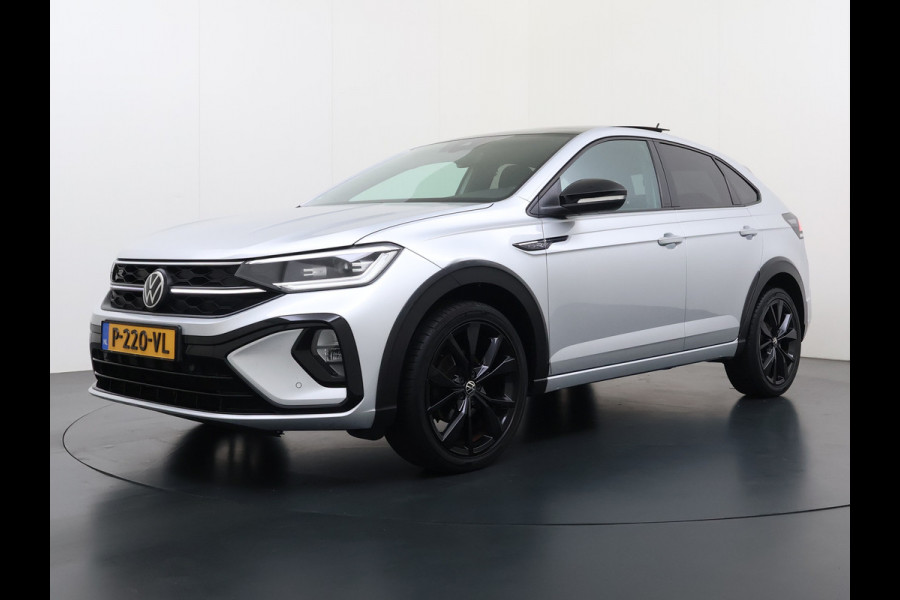 Volkswagen Taigo 1.0TSI Automaat R-Line Panoramadak Camera Adap.Cruise Trekhaak Stoelverwarming Apple Carplay Android Auto Navi Ecc Draadloze telefoonlader Keyless Lmv DAB Bluetooth IQ Light Pdc Isofix Privacy Glas Led Rijstrooksensor 1100KG Trekgewicht