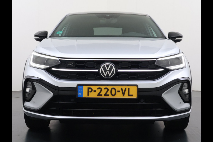 Volkswagen Taigo 1.0TSI Automaat R-Line Panoramadak Camera Adap.Cruise Trekhaak Stoelverwarming Apple Carplay Android Auto Navi Ecc Draadloze telefoonlader Keyless Lmv DAB Bluetooth IQ Light Pdc Isofix Privacy Glas Led Rijstrooksensor 1100KG Trekgewicht