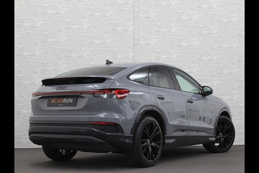 Audi Q4 Sportback e-tron 40 S-Line 77 kWh | Sportstoelen | SOH 98,5 % | H-Leder | ACC | Lane ass. | Virtual + | Black-Optic | Stoelverwarming | Camera | Matrix-Led | Getint Glas | Zwarte Hemelbekleding | MMi+ | 3-Zone Clima | Bovag Garantie |