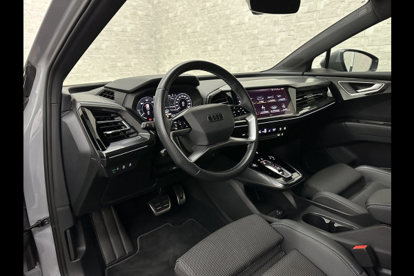 Audi Q4 Sportback e-tron 40 S-Line 77 kWh | Sportstoelen | SOH 98,5 % | H-Leder | ACC | Lane ass. | Virtual + | Black-Optic | Stoelverwarming | Camera | Matrix-Led | Getint Glas | Zwarte Hemelbekleding | MMi+ | 3-Zone Clima | Bovag Garantie |