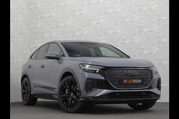 Audi Q4 Sportback e-tron 40 S-Line 77 kWh | Sportstoelen | SOH 98,5 % | H-Leder | ACC | Lane ass. | Virtual + | Black-Optic | Stoelverwarming | Camera | Matrix-Led | Getint Glas | Zwarte Hemelbekleding | MMi+ | 3-Zone Clima | Bovag Garantie |