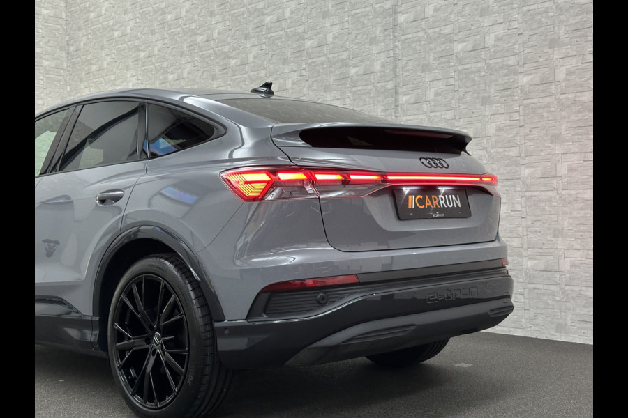 Audi Q4 Sportback e-tron 40 S-Line 77 kWh | Sportstoelen | SOH 98,5 % | H-Leder | ACC | Lane ass. | Virtual + | Black-Optic | Stoelverwarming | Camera | Matrix-Led | Getint Glas | Zwarte Hemelbekleding | MMi+ | 3-Zone Clima | Bovag Garantie |